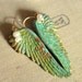 Angel wings patina pearly Heart with goldfield ear hooks .