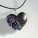 Black heart pendant with purple roses on black cotton cord necklace
