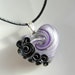 Heart pendant in silver and purple with black and silver roses on black cotton cord necklace