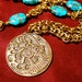Celtic Cats a bronze triskele necklace