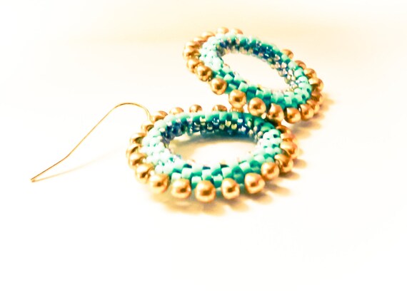 Items similar to Gypsy hoop earrings. Beaded boho chic turquoise gold