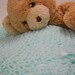 Knit Baby Blanket Trimmed with Aqua Ribbons