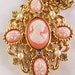 Vintage signed Avon faux pink cameo necklace with simlated pearl and clear rhinestone accents