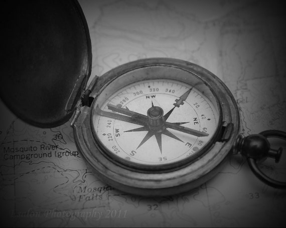 Old vintage U.S. compass on map this is an by EsalonPhotography