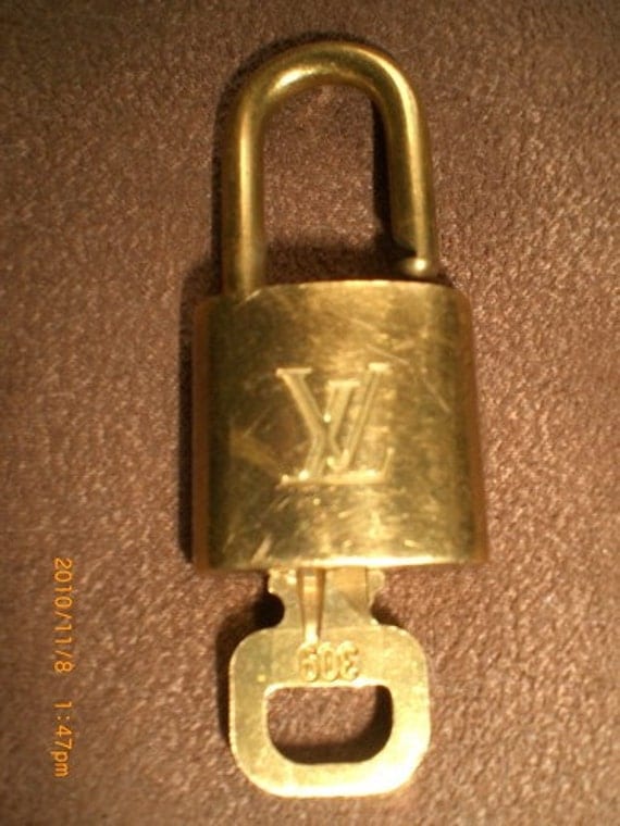 vintage brass Louis Vuitton lock and key