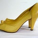 yellow heels with bow
