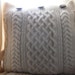 Small Cream Cushion / Pillow Throw . Knit in 100% wool cable cover with dark brown wooden buttons . Recycled / Upcycled
