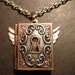 Steampunk Book Locket with Wings and Ornate Key Hole (432)