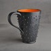 Spiky Mug: Black and Orange Dangerously Spiky Travel Mug by Symmetrical Pottery