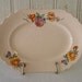 Vintage Shell Pink Plate with Orange and Rose-colored Sweet Pea Flowers