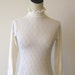 White Lacy Ruffle High Neck Bodysuit