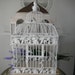 antiqued slightly distressed bird cage floral cage weddings white card holder center piece hanging bird cage