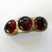 Barrette Red Glass beads with gold set in clay