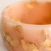 Rose gold eco resin round bangle with suspended gold flakes