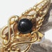 Symbols Of The Sun Gold and Black Stone Cocktail Ring