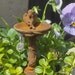 miniature birdbath with sleeping angel