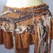 bohemian inspired foresty leather skirt/belt with lace ruffles,studs and butterfly motif...