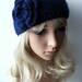 Hand knitted headband ear warmer with crochet flower navy blue
