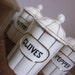 Set of Six Vintage Ceramic Spice Canisters Gold and White