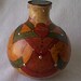 Fat cutneck gourd box with wood burned patterns and silver nail head accents on aluminum wire base. Item 1361.
