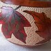 Wood burned and carved gourd bowl with ink dyed assorted variegated color leaves.1521.