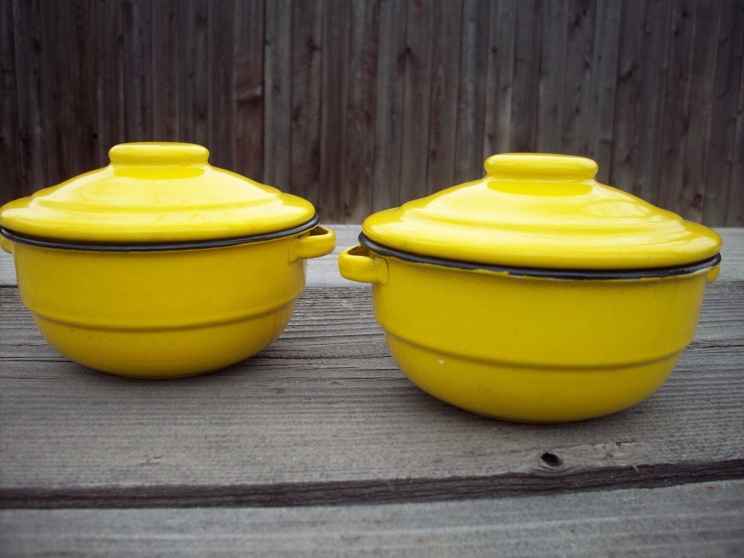 Set of yellow enamelware bowls with lids