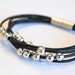 Mutilaced Black rolling ball with magnetic leather bracelet