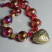 Bronze Heart Necklace with Iridescent Red Round and Cube Beads