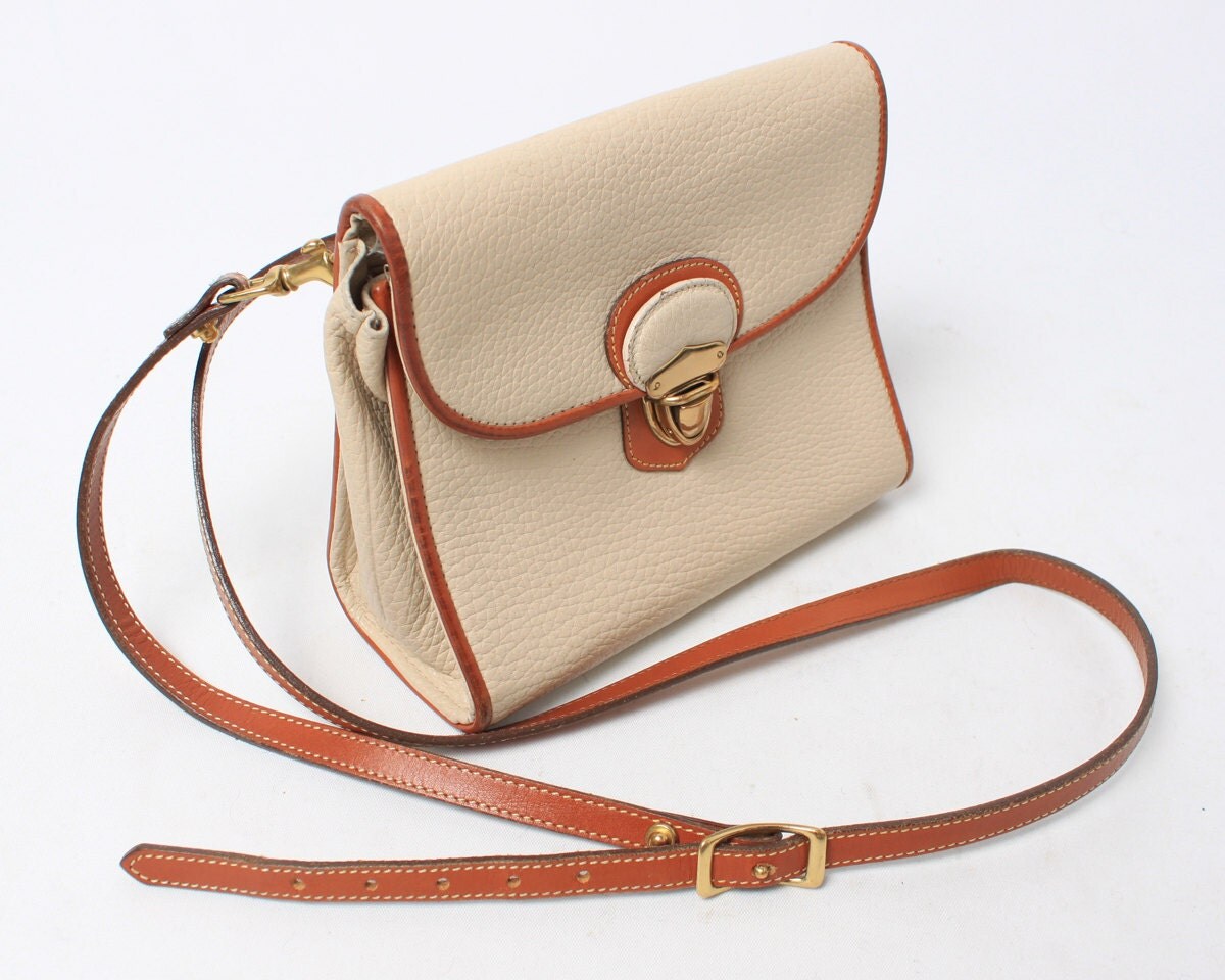Dooney and Bourke Purse in Cream Leather with Brown Belt Strap