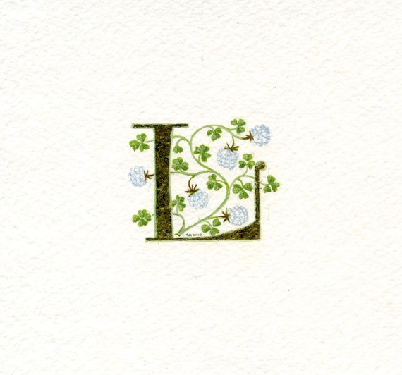 Gold leaf initial letter 'L' with handpainted lucky