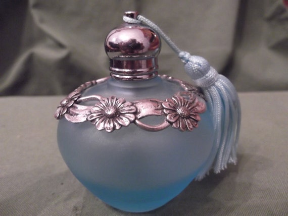 Vintage teal glass perfume bottle with tassel