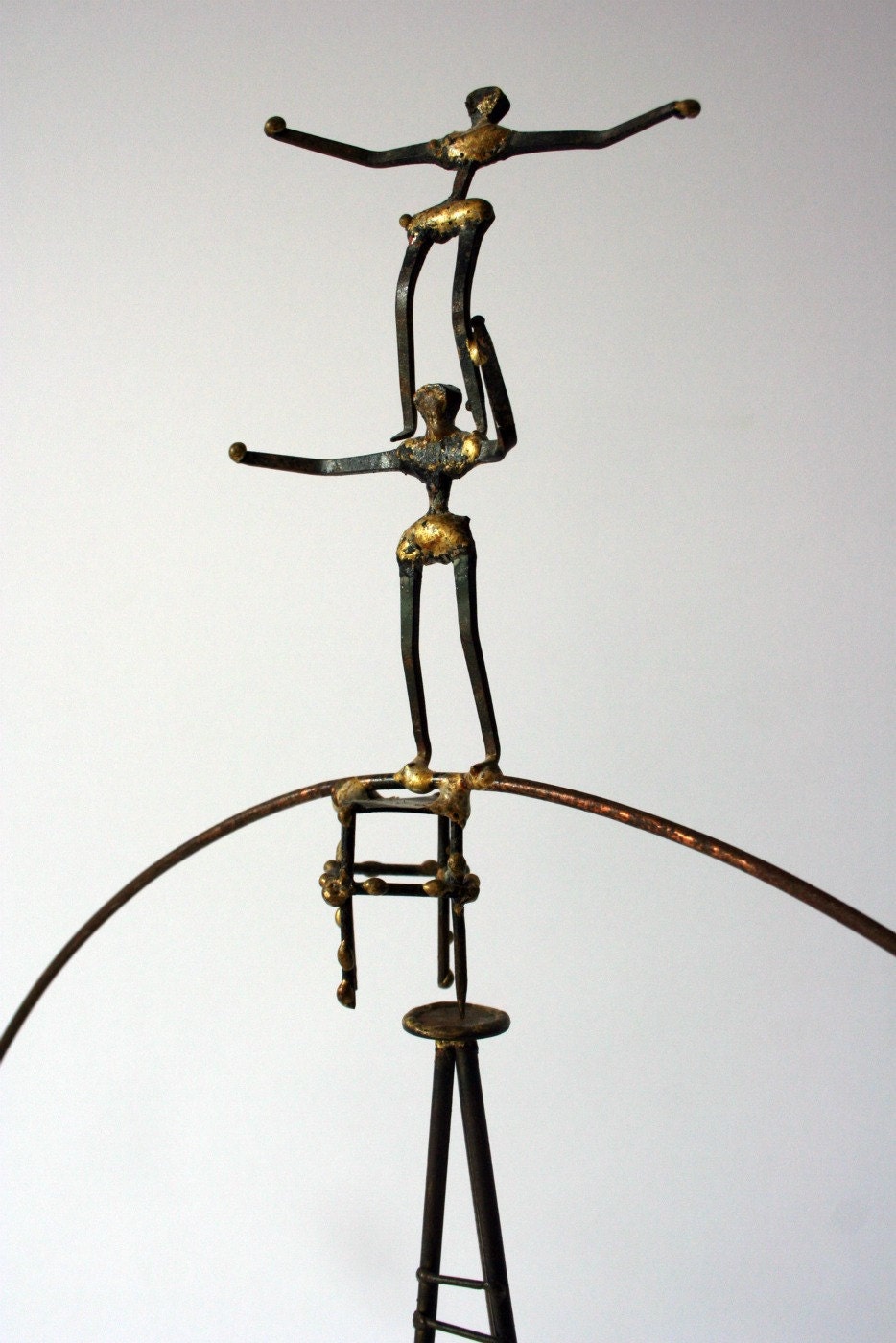 Vintage metal sculpture balancing acrobats