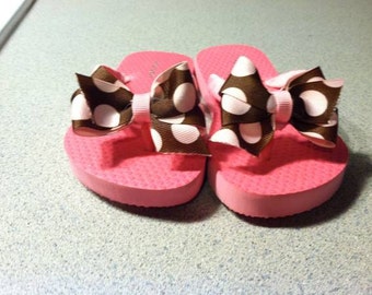 Girls pink decorated flip flops