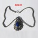Large Vintage Pendant with Lily Motif embellished with a Blue Cabochon Center Stone