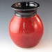 Red Glazed Vase With Black Rim....Reserved for Catherine