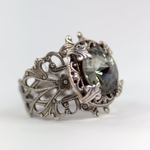 ... ring inlaid with two wonderful grey diamonds giving the ring a