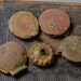 Set of 4 metal caps, parts of antique pipes bows