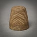Antique brass thimble. Black patina