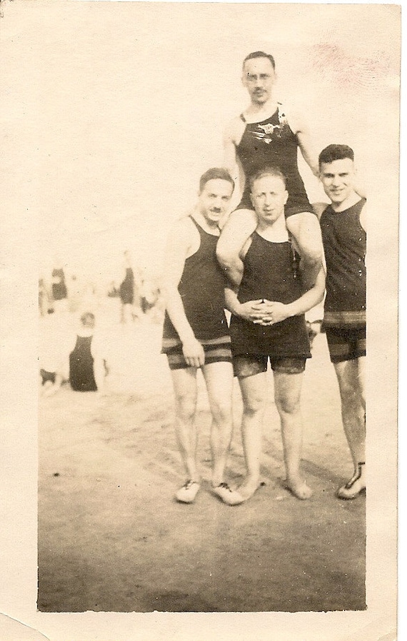 1920's photo .Men in bathing suits on the beach