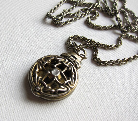 Vintage silver and brass gothic filigree locket