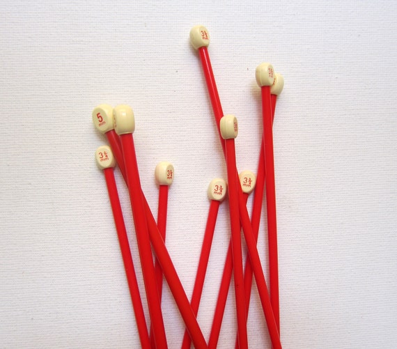 Vintage red and cream plastic knitting needles supplies
