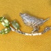 Silver bird brooch with peridot, bird on a branch, lime green natural peridot stones