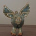 Green Flying Pig made of clay