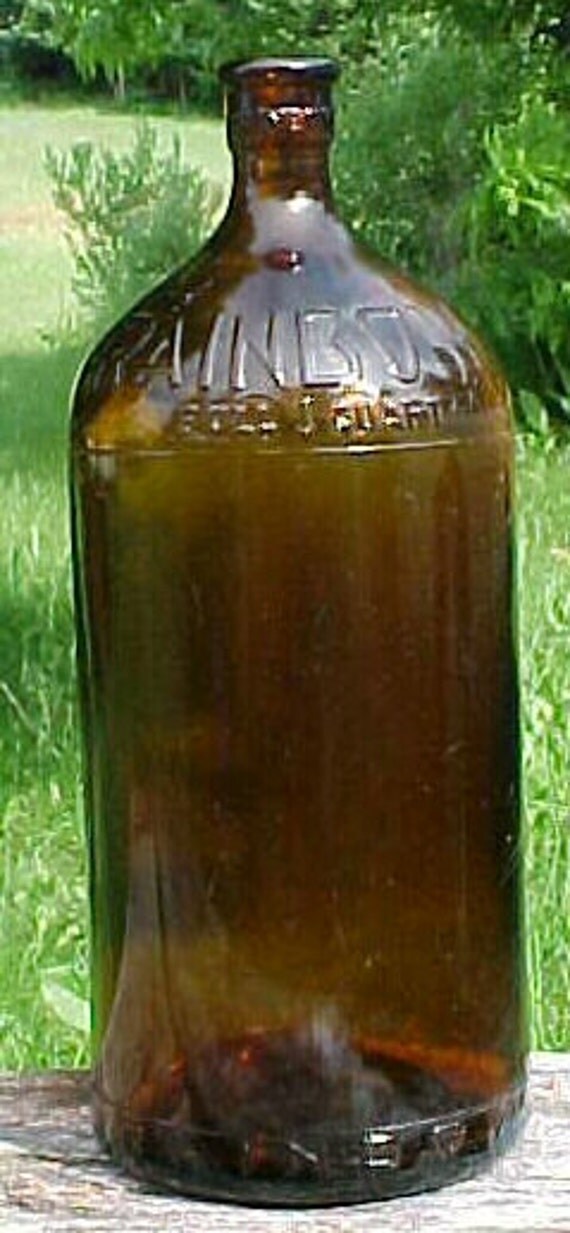 1930s Rainbow Bleach Bottle Full Quart Cork Top Amber