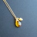 czech glass topaz teardrop with petite golden pinecone