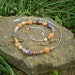 Misty Morning beaded necklace, Botswana agate, red aventurine, bamboo agate, sterling silver feather charm