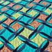 BATIK genuine African wax print fabric - 1 ft. Remnant- Teal, Orange, Yellow Boomerang Pattern