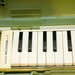 Vintage White Suzuki A-27 Melodica with funky Green Plastic Case