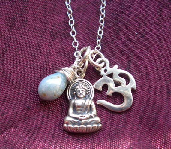 Om Buddha necklace with wrapped blue Czech glass bead