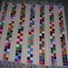 Lovely chrochet unique afghan with chrochet flowers 62 wide and 62 long with 4 inch hand tied tossles